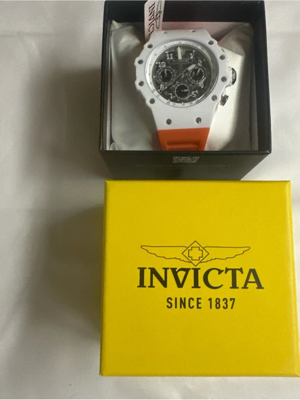 (276) Invicta White and Orange Sport Watch